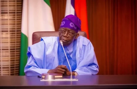 President Bola Tinubu speaking at the 2025 International Civil Service Conference in Abuja, with officials and civil servants in attendance.