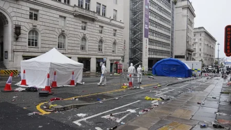 Police given more time to question suspect after car hit 79 fans at Liverpool's title parade. Seven remain in hospital; incident not treated as terrorism.