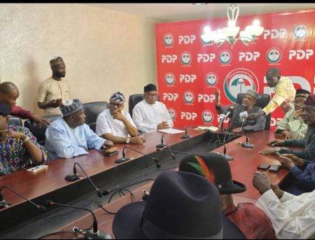 PDP Acting Chairman announces reinstatement of Senator Anyanwu and cancellation of NEC meeting at press conference.