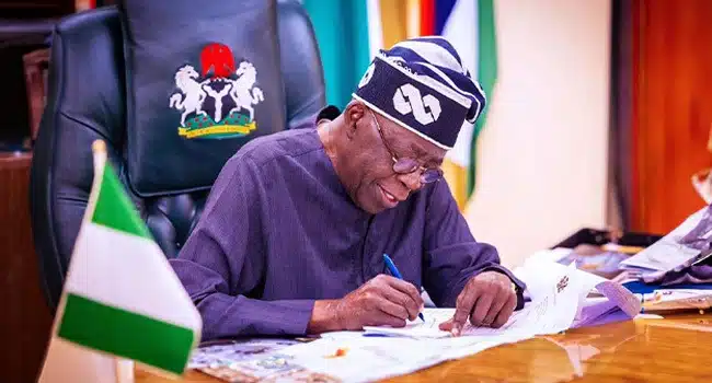 Tinubu appoints new leadership for NTA Government officials review Nigeria’s 2026 budget documents during a planning session.