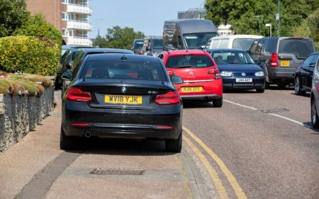 Liberal democrat council to charge residents £70 for parking outside their homes Parking cars