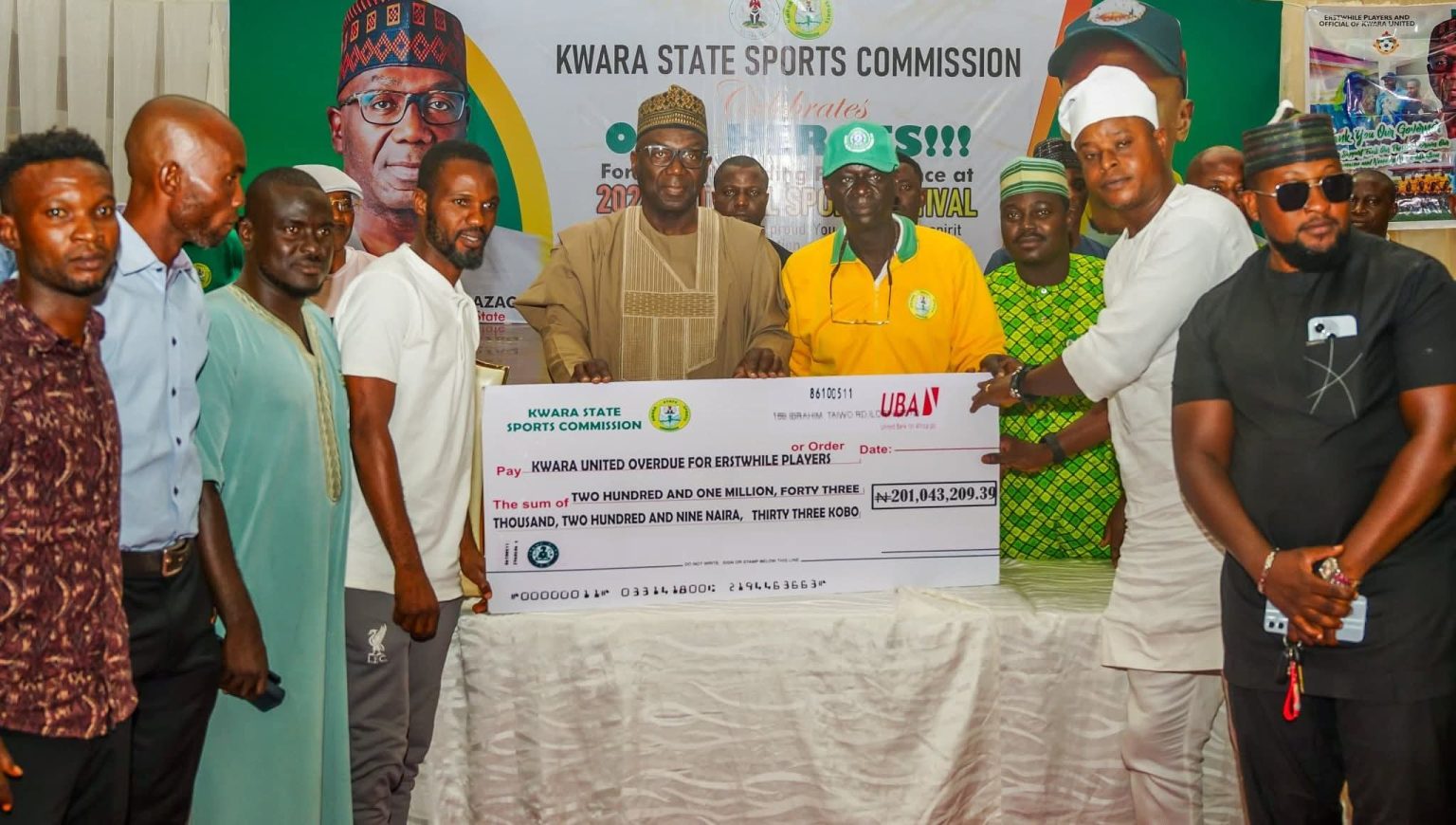 Governor AbdulRahman AbdulRazaq rewarding athletes who participated in the 2024 National Sports Festival in Abeokuta, Ogun State