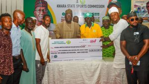Governor AbdulRahman AbdulRazaq rewarding athletes who participated in the 2024 National Sports Festival in Abeokuta, Ogun State