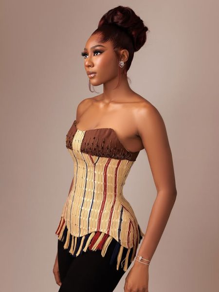 Laura Ajayi in a corset aso-oke top