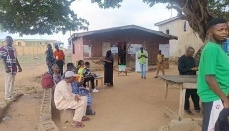 INEC officials set up polling station in Ibadan North by-election amid low voter turnout and delayed arrivals.
