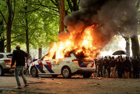 Teen freed from Dubai jail dies in London car crash A police car set ablaze during protest