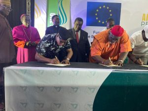 Flag bearers of political parties signing peace accord