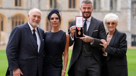 David Beckham knighted by King Charles for services to football and British society, joined by wife Victoria and family at Windsor Castle ceremony.