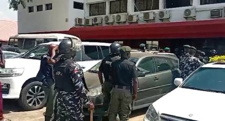 Security personnel guard PDP national headquarters in Abuja as Abdulrahman Mohammed resumes as acting national chairman amid leadership turmoil.