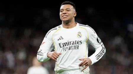 Kylian Mbappé marked his 27th birthday by equalling Cristiano Ronaldo’s 59-goal calendar-year record as Real Madrid beat Sevilla 2-0 at the Bernabéu.