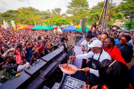 Governor Babajide Sanwo-Olu cooking at the festival