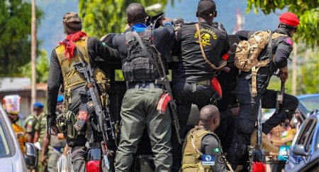Kogi State security officers escort rescued children to safety during an anti-trafficking operation.