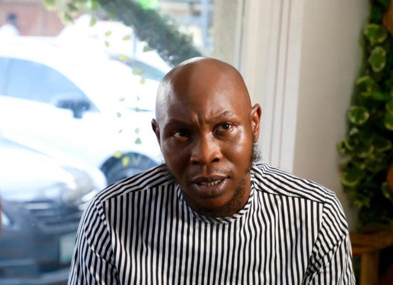 Seun Kuti speaking during an interview, recalling his father Fela Kuti’s detention and a childhood visit to Panti police facility.