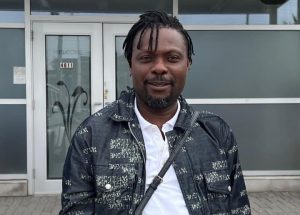 Kunle Afod speaking in a video highlighting poor road conditions and abandoned school facilities in Ose LGA, Ondo State.