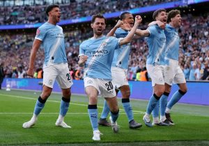 Manchester City celebrating their Semi final victory against Southampton at Wembley