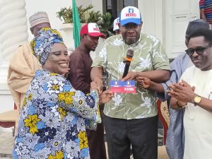 Dickson Welcomes ADC, Labour, SDP Defectors to NDC Seriake Dickson presenting NDC membership cards to defectors from ADC, LP, and SDP in Abuja.