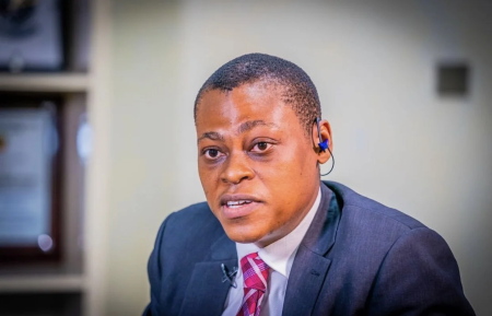 Arise News anchor Rufai Oseni speaking during a television broadcast while discussing Atiku Abubakar and political zoning.