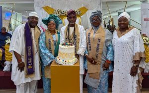 Prince Olurebi, his wife, the Olowu of Owu, Oba Saka Adelola, and his wives.