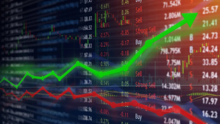 Nigerian Exchange trading floor with stock market data screens showing rising index values