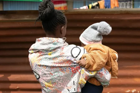 A woman holding a baby